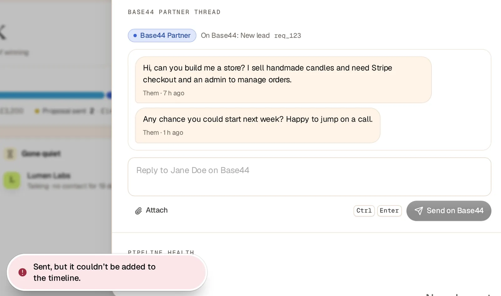A test client's Base44 Partner thread with an empty reply box, and a pink toast saying Sent, but it couldn't be added to the timeline