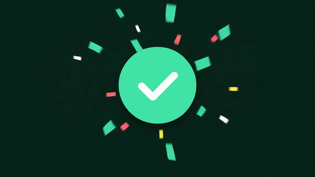 A frame from the Deploy loop: a mint circle with a white tick and confetti flying out, on dark green.